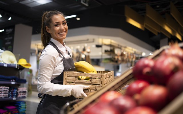 supermarket-worker-supplying-fruit-department-with-food.jpg
